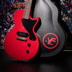 Included hardshell case alongside the Radiant Red Les Paul Junior