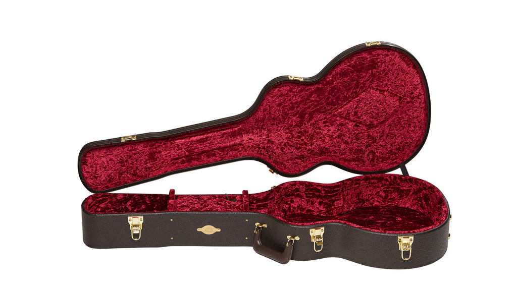 Open empty Taylor case showing the red crushed velvet lining and double neck cradles