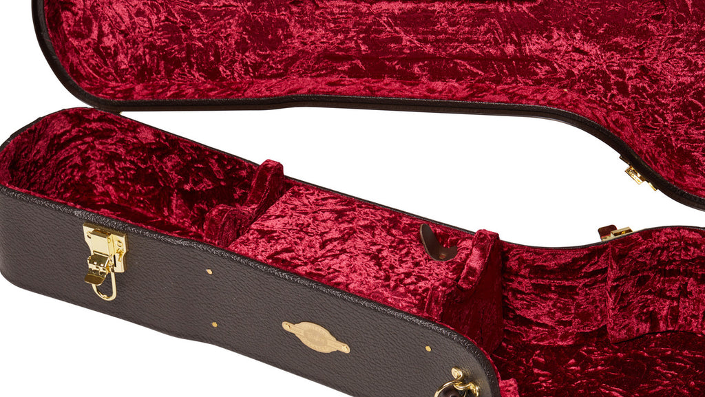 Neck cradles and interior accessories compartment lined in red crushed velvet