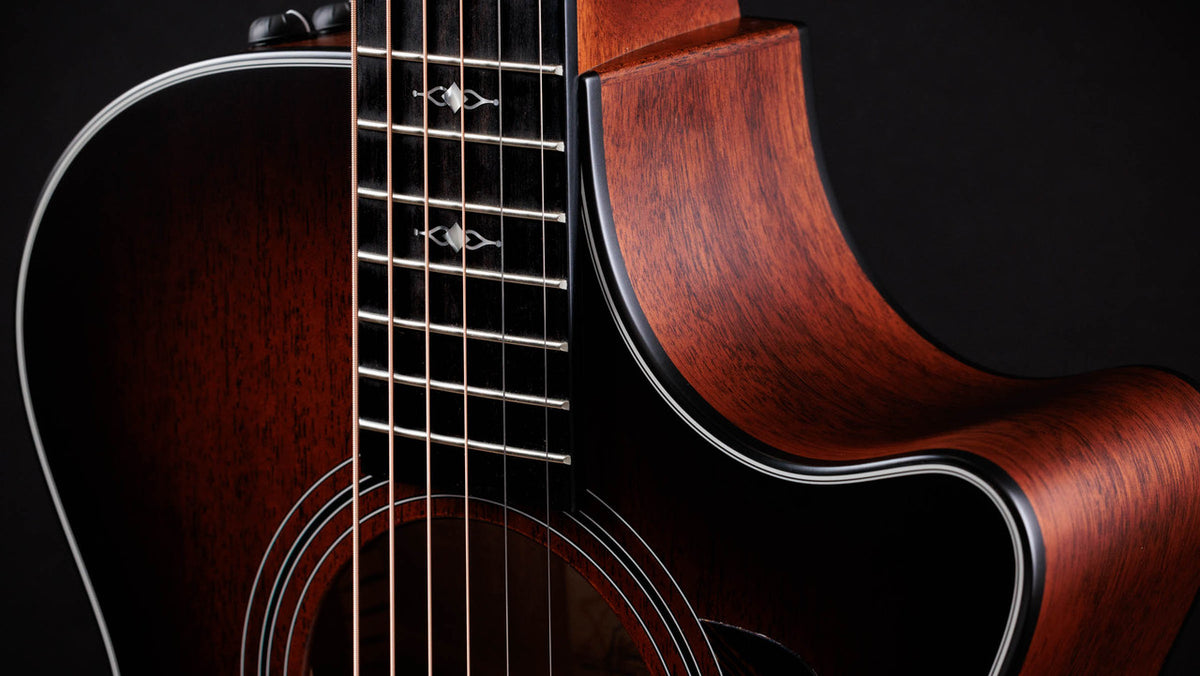 Venetian cutaway and mahogany side meeting the satin mahogany top of the Taylor 322ce