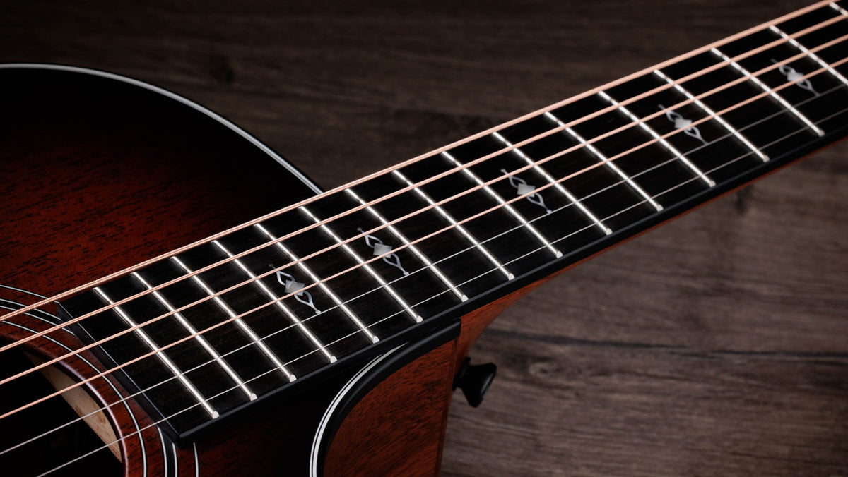Crelicam ebony fingerboard with faux pearl Gemstone inlays on the Taylor 322ce