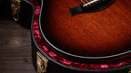 Crelicam ebony bridge and Micarta saddle, guitar resting in the included hardshell case
