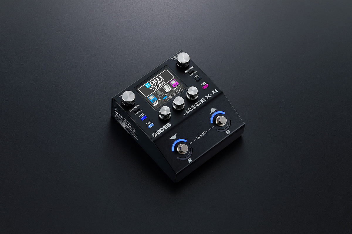 BOSS EX-4 Effects Expander on a dark studio background with the screen lit