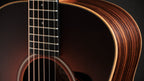 Upper bout and ebony fingerboard end against the layered rosewood side