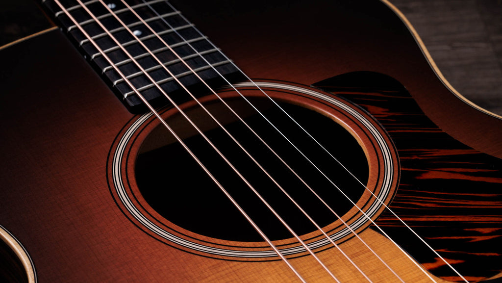 Three-ring rosette and firestripe pickguard around the soundhole