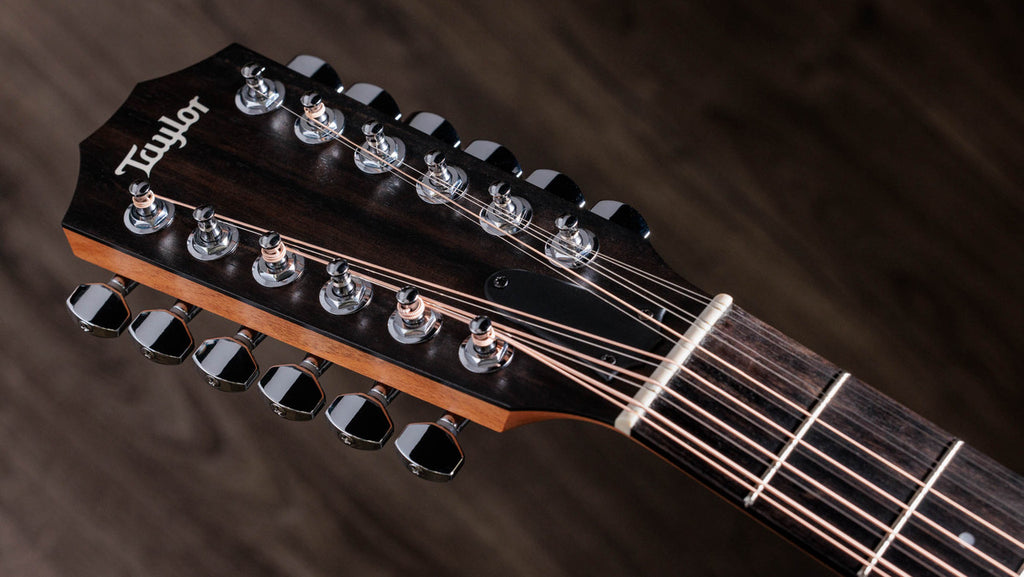 Taylor 150ce headstock with twelve chrome tuners and white Tusq nut
