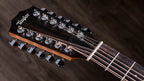 Taylor 150ce headstock with twelve chrome tuners and white Tusq nut