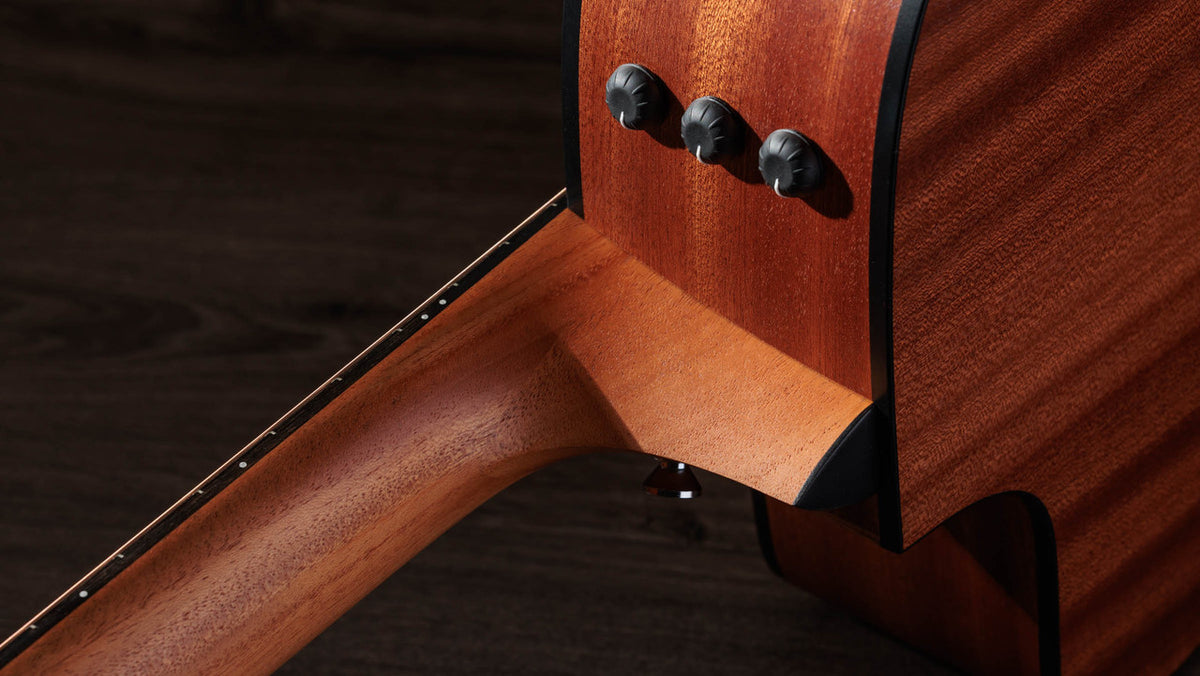 Side-mounted ES2 volume and EQ dials on the sapele upper bout