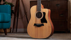 Taylor 150ce 12-string dreadnought standing in a lounge room showing the full front